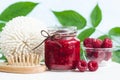 Homemade raspberry face and hair mask/scrub in a glass jar. DIY cosmetics and spa.