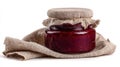 Homemade raspberry jam jar sits on burlap, ready for enjoyment Royalty Free Stock Photo