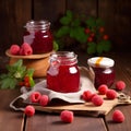 Homemade raspberry jam and raspberry on wooden backgrounds