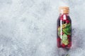 Homemade raspberry mint black currant lemonade in glass bottle. Summer healthy drink Royalty Free Stock Photo