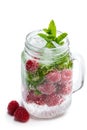 Homemade raspberry and mint drink in glass jar isolated on white Royalty Free Stock Photo