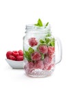 Homemade raspberry and mint drink in glass jar isolated on white Royalty Free Stock Photo