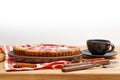 Homemade raspberry pie with yogurt filling and cup of tea on wooden table. Front view. Royalty Free Stock Photo