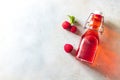 Homemade raspberry vinegar and fresh raspberries. Flat lay