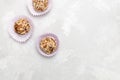 Homemade raw candy energy balls with dried dates, nuts, oats and seeds on neutral background Royalty Free Stock Photo