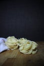 Homemade raw egg noodles on a background