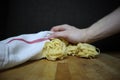 Homemade raw egg noodles on a background