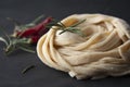 Homemade raw pasta. Italian traditional raw pasta on black background, top view Royalty Free Stock Photo