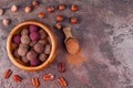 Homemade Raw Vegan Cacao Energy Balls in Wooden Bowl on Brown Marble Background Royalty Free Stock Photo