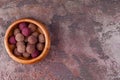 Homemade Raw Vegan Cacao Energy Balls in Wooden Bowl on Brown Marble Background Royalty Free Stock Photo