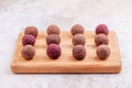 Homemade Raw Vegan Cacao Energy Balls on Wooden Tray on White Marble Background Royalty Free Stock Photo