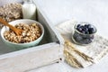 Homemade Ready breakfast granola, muesli with fresh ripe blueberry, multigrain cakes, white chocolate and milk. Close-up, useful