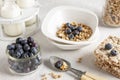 Homemade Ready breakfast granola, muesli with fresh ripe blueberry, white chocolate, multigrain cakes and milk. Close-up, useful