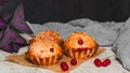 Homemade red currant muffins with sesame seeds. Closeup. Copy space Royalty Free Stock Photo