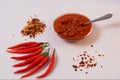 Homemade red Harissa Paste, chili pepper spices and fresh red chilli peppers Royalty Free Stock Photo