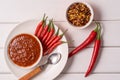 Homemade red Harissa Paste, chili pepper spices and fresh red chilli peppers Royalty Free Stock Photo