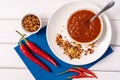 Homemade red Harissa Paste, chili pepper spices and fresh red chilli peppers Royalty Free Stock Photo