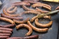 Homemade sausages roasted in barbecue and in oil Royalty Free Stock Photo
