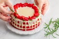 Homemade red velvet cake with white chocolate,  fresh strawberries and rosemary Royalty Free Stock Photo