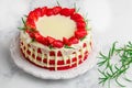 Homemade red velvet cake with white chocolate, fresh strawberries and rosemary Royalty Free Stock Photo