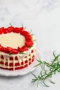 Homemade red velvet cake with white chocolate, fresh strawberries and rosemary Royalty Free Stock Photo