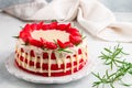 Homemade red velvet cake with white chocolate, fresh strawberries and rosemary Royalty Free Stock Photo