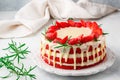 Homemade red velvet cake with white chocolate, fresh strawberries and rosemary Royalty Free Stock Photo