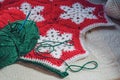 Homemade red and white crochet snowflake