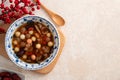 Homemade red and white tangyuan with syrup soup, dried longan pulp, red dates for Winter solstice Royalty Free Stock Photo