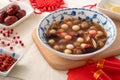 Homemade red and white tangyuan with syrup soup, dried longan pulp, red dates for Winter solstice Royalty Free Stock Photo