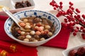 Homemade red and white tangyuan with syrup soup, dried longan pulp, red dates for Winter solstice Royalty Free Stock Photo