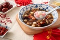 Homemade red and white tangyuan with syrup soup, dried longan pulp, red dates for Winter solstice Royalty Free Stock Photo