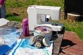 Homemade respirator, a box of sewing items, a sewing machine and plastic materials