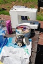 Homemade respirator, a box of sewing items, a sewing machine and plastic materials