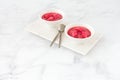 Homemade Rhubarb Compote in White Bowls on White Marble