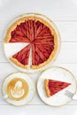 Homemade rhubarb and strawberry pie and cup of coffee on white wooden table Royalty Free Stock Photo