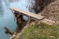 Homemade river diving board mounted on tree stump