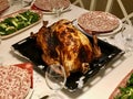 Homemade Roasted Thanksgiving Day Turkey with all the Sides at Dinner Table. Royalty Free Stock Photo