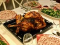 Homemade Roasted Thanksgiving Day Turkey with all the Sides at Dinner Table. Royalty Free Stock Photo