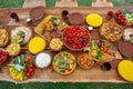 Homemade Romanian Food with grilled meat, polenta and vegetables Platter on camping.