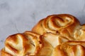 Homemade rose bread on white textured background, close-up, shallow depth of field, top view Royalty Free Stock Photo