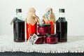 Homemade rose petal jam and berries syrup in bottles Royalty Free Stock Photo