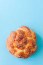 Homemade round challah with sesame seeds. Traditional jewish pastry