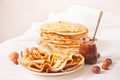 Homemade russian thin tasty pancakes on the plate with chocolate cream sauce