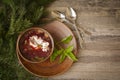 Homemade russian, ukrainian and belarussian national soup - red borscht made of beetrot, vegetables and meat with sour cream on a Royalty Free Stock Photo