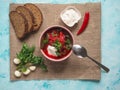 Homemade Russian, Ukrainian and Polish national soup - red borscht made of beetrot, vegetables and meat with sour cream. Royalty Free Stock Photo