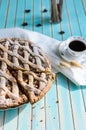 Homemade rustic apple tart pie on dish over wooden turquoise background