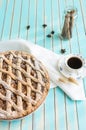 Homemade rustic apple tart pie on dish over wooden turquoise background