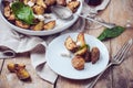 Homemade rustic dinner: a glass of wine and a baked potato