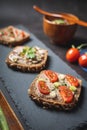 Homemade Rustic Pate on a Bitten Slice of Bread with Fresh Vegetables